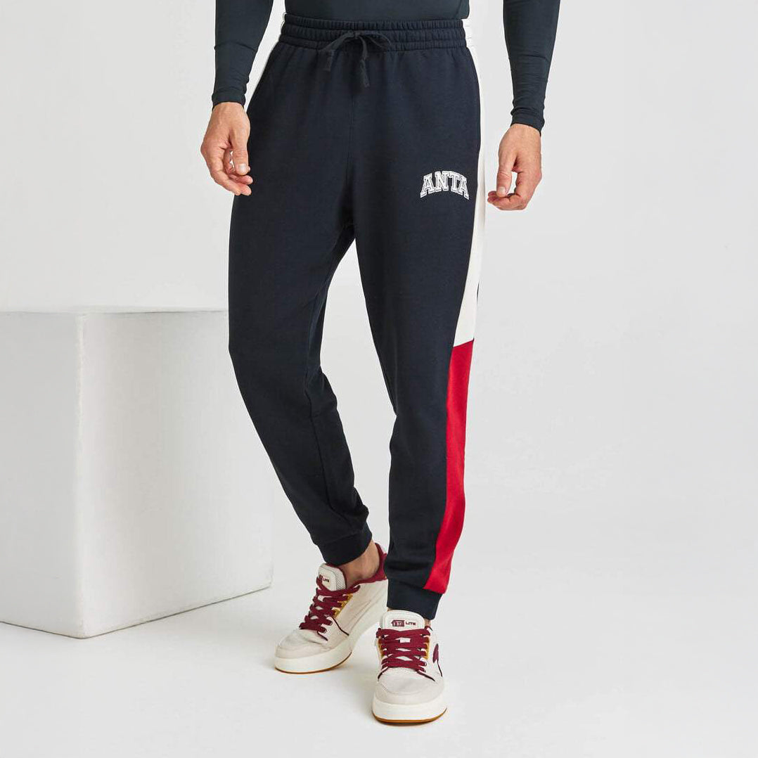 Pantalon de jogging Anta noir avec bandes rouge et blanc – Confort et style sport

